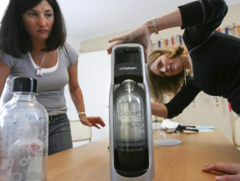 Joanne Domeniconi (left) and Jeanne Connon tested a SodaStream product for the Daily Grommet. (Aram Boghosian for The Boston Globe) 