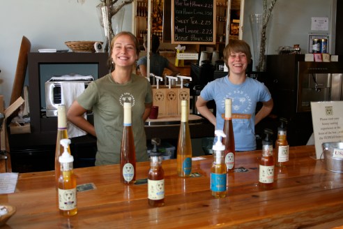 With equally charming people inside, sampling honey for visitors.