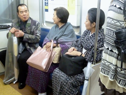 Two ladies in everyday kimonos on the subway. I learned that younger women will make an appointment and pay $300 to get help with being dressed for a formal occasion in a kimono.