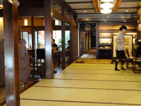You usually encounter a sort of Japanese version of a "mud room" when you come in.  It's a place to take off your evil dirty street shoes before you step on the pristine tatami mat in your socks.