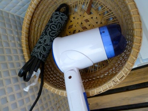 And the handmade fabric covered cardboard sleeve used to corral the blow dryer cord.  There is something very Japanese about the contrast of this attention to detail, the leaving the hairdryer free and vulnerable to theft (not a big risk with Japanese people) yet a kind of weak and cheesy dryer design.  Maybe they did find they were getting stolen too often, by non-Japanese?