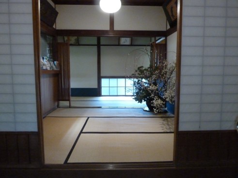 Entrance to the Hakone/Mt. Fuji area ryokan.  Note the gorgeous seasonal greens and flowers arrangement. 