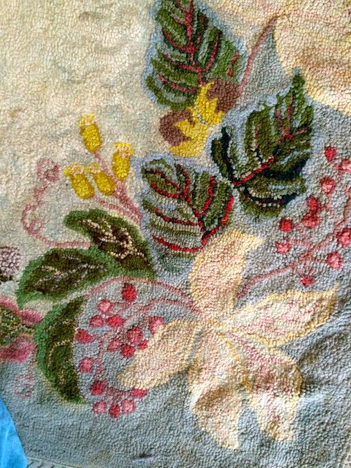 Detail of an exquisite hooked wool rug