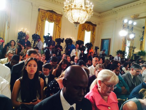Note the press of, well, press behind the crowd eagerly awaiting the POTUS.