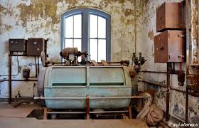 Much of the original equipment is still intact, including this laundry room installation. More than 3,000 pieces of laundry were cleaned daily.